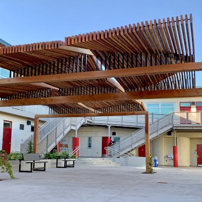 Custom Wooden Pergola (Options: California Redwood, Custom Post Anchor Kit, Transparent Premium Sealant). Installled in The Carey School at 1 Carey School Lane, San Mateo, CA 94403. 