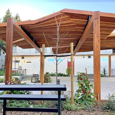 Custom Wooden Pergola (Options: California Redwood, Custom Post Anchor Kit, Transparent Premium Sealant). Installled in The Carey School at 1 Carey School Lane, San Mateo, CA 94403. 