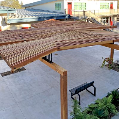 Custom Wooden Pergola (Options: California Redwood, Custom Post Anchor Kit, Transparent Premium Sealant). Installled in The Carey School at 1 Carey School Lane, San Mateo, CA 94403. 