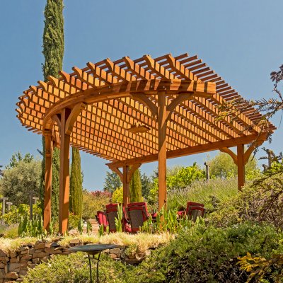 Custom Wooden Pergola (Options: 17' L x 17' W, California Redwood, Electrical Wiring Trim for 1 Post, 5-Post Anchor Kit for Concrete, No Ceiling Fan Base, No Privacy Panels, No Curtain Rods, Transparent Premium Sealant). Photo Courtesy of K. Drahmann of El Dorado Hills, CA.