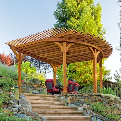 Custom Wooden Pergola (Options: 17' L x 17' W, California Redwood, Electrical Wiring Trim for 1 Post, 5-Post Anchor Kit for Concrete, No Ceiling Fan Base, No Privacy Panels, No Curtain Rods, Transparent Premium Sealant). Photo Courtesy of K. Drahmann of El Dorado Hills, CA.