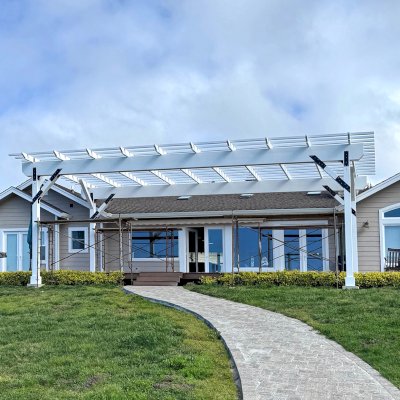 Custom Wooden Pergola (Options: 40' x 19', California Redwood, 12' H Posts, 8x8 Posts, 8x19 Composite Supports, 3x8 Rafters, 3x3 Slats, No Ceiling Fan Base, Posts Anchor Kit for High-Wind, Off-White Oil-Based Primer). Photo Courtesy of J. Adams of Mendocino, CA.