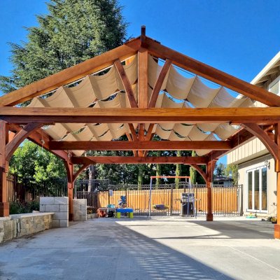 Custom Pergola (Options: 20' x 20', Mature Redwood, Electrical Wiring Trim for 2 Posts, Post Anchor Kit for Concrete, Transparent Premium Sealant). Canopy Installed by Customer. Photo Courtesy of R. Holcomb of Santa Clara, CA.