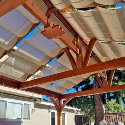 Custom Pergola (Options: 20' x 20', Mature Redwood, Electrical Wiring Trim for 2 Posts, Post Anchor Kit for Concrete, Transparent Premium Sealant). Canopy Installed by Customer. Photo Courtesy of R. Holcomb of Santa Clara, CA.