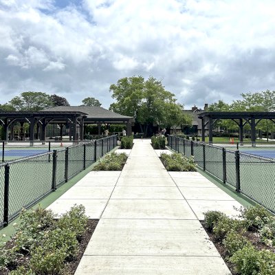 Custom Attached Wooden Pergola (Options: 15' 7 1/2" W x 44' L, California Redwood, 12 x 12 Posts, 9' H, Post Anchor Kit for High-Wind, Custom Stain). Photo Courtesy of C/O Country Club of Detroit, Grosse Pointe Farms, MI.