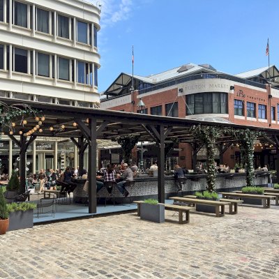 Custom Wooden Pergola (Options: 82' L x 16' W, Douglas-fir, Open Roof with Rafters at 18", with Transparent Rain Guard, 12-Post Anchor Kit, No Ceiling Fan Base, 12' Post Height, Custom Black Paint). This pergola is part of the giant popup beer hall at the Southside Seaport in downtown Manhattan from May to Oct 2017: https://www.timeout.com/newyork/blog/a-giant-pop-up-beer-hall-is-opening-at-south-street-seaport-this-summer-032417
