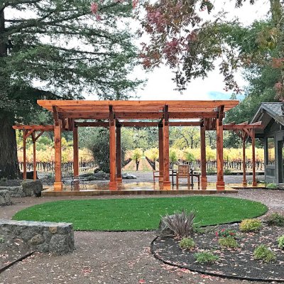 Custom Wooden Pergola (Options: 28' x 20', California Redwood, Posts Anchor Kit for Concrete, Transparent Premium Sealant). Photo Courtesy of S. Taplin of St. Helena, CA.