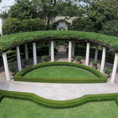 Custom Wooden Pergola (Options: 50' half circle, Old-Growth Redwood, No Posts, Transparent Premium Sealant). Pergola Installed in Mexico City. Photo Courtesy of Alfonso Barajas.