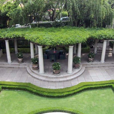 Custom Wooden Pergola (Options: 50' half circle, Old-Growth Redwood, No Posts, Transparent Premium Sealant). Pergola Installed in Mexico City. Photo Courtesy of Alfonso Barajas.