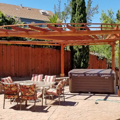 Custom Wooden Pergola (Options: 20' L, 13' W, California Redwood, 1 Electrical Wiring Trim, 4 Post Anchor Kit for High-Wind, No Privacy Panels, Curtain Rods on 4 sides, 8.5' Post Height, Transparent Premium Sealant). Photo Courtesy of Chip Hansel of Brisbane, CA.