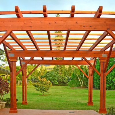 Custom Wooden Pergola (Options: 39' x 50', Mature Redwood, 3 1/8" x 15" Glulam Beams/Supports, 3 3/4" x 7 1/4" Rafters and 1 3/4" x 3 3/4" Slats, Double 5 /12" x 5 1/2" x 10' Posts, Custom Post Anchors, Transparent Premium Sealant). Photo Courtesy of D. Cole of Maui, Hawaii.