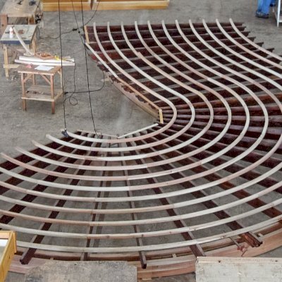 You dream it, we build it: This custom curvy pergola roof was photographed on the shop floor with the slats still unstained. It is a huge, complicated and beautiful project and we decided to post it to the site even unfinished to show it off in case the customer does not get around to sending photos after it is installed! Yes, we can build anything you can imagine if it is made from wood...