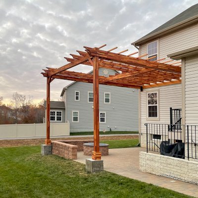 Custom Attached Wooden Pergola (Options: 18' W x 22' L, Mosaic Redwood, 12' H Posts, Transparent Premium Sealant). Photo Courtesy of Anthony Campanale of Waldorf, MD.
