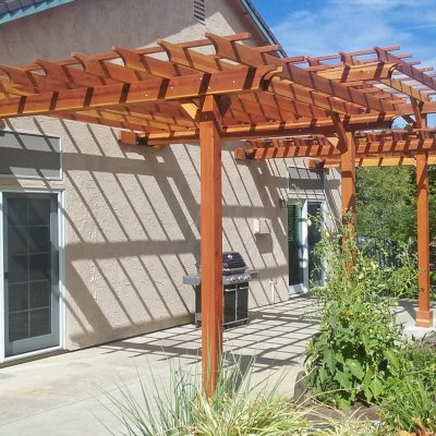 Custom Wooden Pergola (Options: 35' L, 13' W, California Redwood, No Electrical Wiring Trim, 4-Post Anchor Kit for Concrete, No Privacy Panels, No Curtain Rods, 10' & 11' Post Height, Transparent Premium Sealant). Photo Courtesy of D. Drake of Auburn, CA.