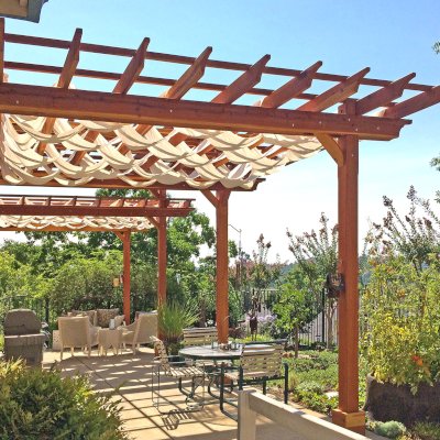Custom Wooden Pergola (Options: 35' L, 13' W, California Redwood, No Electrical Wiring Trim, 4-Post Anchor Kit for Concrete, No Privacy Panels, No Curtain Rods, 10' & 11' Post Height, Transparent Premium Sealant). Photo Courtesy of D. Drake of Auburn, CA.