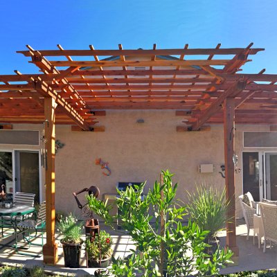 Custom Wooden Pergola (Options: 35' L, 13' W, California Redwood, No Electrical Wiring Trim, 4-Post Anchor Kit for Concrete, No Privacy Panels, No Curtain Rods, 10' & 11' Post Height, Transparent Premium Sealant). Photo Courtesy of D. Drake of Auburn, CA.