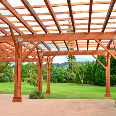 Custom Wooden Pergola (Options: 39' x 50', Mature Redwood, 3 1/8" x 15" Glulam Beams/Supports, 3 3/4" x 7 1/4" Rafters and 1 3/4" x 3 3/4" Slats, Double 5 /12" x 5 1/2" x 10' Posts, Custom Post Anchors, Transparent Premium Sealant). Photo Courtesy of D. Cole of Maui, Hawaii.