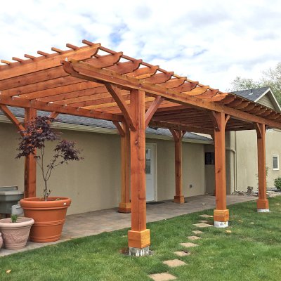 Custom Wooden Pergola (Options: 14' L x 12' W, California Redwood, One Ceiling Fan Base, Electrical Wiring Trim Kit for 1 Post, 8-Post Anchor Kit for High-Wind, 8 x 8 Posts by Custom Request, Transparent Premium Sealant) with a 12' x 24' Shed Pavilion Attached. Photo Courtesy of G. Scotzin of Pasco, WA.
