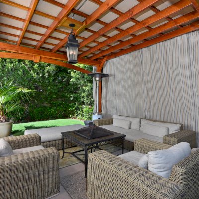 Custom Wooden Pergola (Options: 17' x 15', California Redwood, 1 Ceiling Fan Base, Custom Arched Brace on Supports Side, Transparent Premium Sealant). Photo Courtesy of Jason Jager.