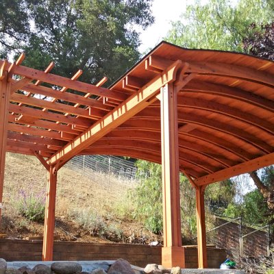 Custom Wooden Pergola with Pavilion (Options: Mature Redwood with Pavilion Ceiling in Old-Growth Redwood, with 2 Fan Bases, Electrical Wiring Trim Kit for 1 Post, 6-Post Anchor Kit for High-Wind, Transparent Premium Sealant). Backyard Pavilion is sized 18 x 18 ft and Garden Pergola is 9 x 14 ft. Yes, you can mix and match different pergola and pavilions in almost any size and configuration to make the perfect shade structure for your yard. Photo Courtesy of Joan Angwin of Morgan Hill, CA.