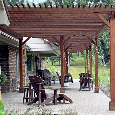 Custom Wooden Pergola (Options: 64' L x 14'-5" W, Mature Redwood, No Electrical Wiring Trim, 9-Post Anchor Kit for Concrete, No Ceiling Fan Base, No Privacy Panels, No Curtain Rods, Transparent Premium Sealant). Photo Courtesy of K. Feliciani of Greensburg, Pennsylvania.