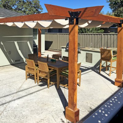 Custom Wooden Pergola (Options: 20' L, 14' W, California Redwood, 4-Post Anchor Kit for Concrete, No Privacy Panels, No Curtain Rods, 4" x 8" x 9.5' Post Height, Transparent Premium Sealant) with an Infinity Canopy Retractable Shade Structure. Photo Courtesy of M. Hall of San Jose, CA.