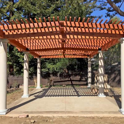 Custom Wooden Pergola (Options: 19' x 32', Mature Redwood, 4-Post Anchor Kit for High-Wind, Trasnparent Premium Sealant). Customer Placed Tuscan Columns Around the Pergola Posts. Photo Courtesy of M. McCook of San Mateo, CA.