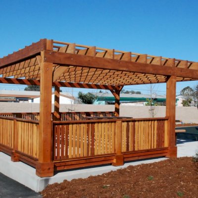 Custom Wooden Pergola (Options: 24' x 24', California Redwood, Open Roof with Slats at 18", Rafters at 18", 1¾" x 9¼" Supports and Rafters, 8 x 8 Posts, Transparent Premium Sealant). Photo Courtesy of Wanlass Park of San Pablo, CA. 