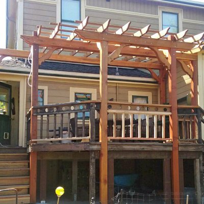Custom Garden Pergola (Options: 18' L x 13' W, California Redwood, Open Roof with Slats at 18" Rafters at 18" Roof Support Timbers, 6-Post Anchor Kit for Concrete, No Ceiling Fan Base, No Privacy Panels, No Curtain Rods, Custom 14' Post Height, Transparent Premium Sealant). Photo Courtesy of E. Seput of Benicia, CA.