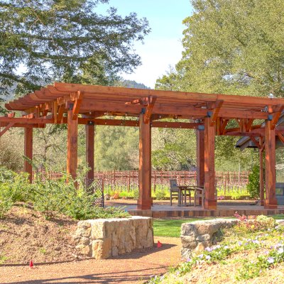 Custom Wooden Pergola (Options: 28' x 20', California Redwood, Posts Anchor Kit for Concrete, Transparent Premium Sealant). Photo Courtesy of S. Taplin of St. Helena, CA.