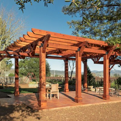 Custom Wooden Pergola (Options: 28' x 20', California Redwood, Posts Anchor Kit for Concrete, Transparent Premium Sealant). Photo Courtesy of S. Taplin of St. Helena, CA.