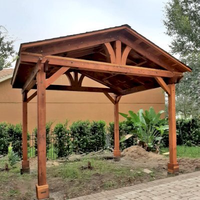 Del Norte Outdoor Kitchen Pavilion (Options: 12' L x 14' W, California Redwood, 4-Post Anchor Kit for High-Wind, 1 Ceiling Fan Base, 1 Electrical Wiring Trim Kit, No Post Decorative Trims, Transparent Premium Sealant). Photo Courtesy of Ion Tiu of Windermere, Florida.