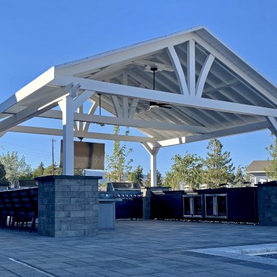 Del Norte Outdoor Kitchen Pavilion (Options: 20' L x 20' W, Douglas-fir, 4-Post Anchor Kit for High-Wind, 2 Fascia Boards, 2 Ceiling Fan Bases, 1 Electrical Wiring Trim Kit, No Post Decorative Trims, Off-White Oil-Based Primer). Photo Courtesy of R. Brooks of Reno, NV.