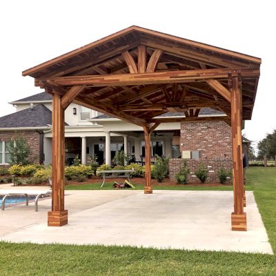 Del Norte Outdoor Kitchen Pavilion (Options: 18' L x 12' W, Mosaic Redwood, 4-Post Anchor Kit for Concrete, 1 Ceiling Fan Base, 2 Electrical Wiring Trim Kits, No Post Decorative Trims, Transparent Premium Sealant). With 5 Posts by Custom Request. Photo Courtesy of A. Bamburg of Natchitoches, Louisiana.