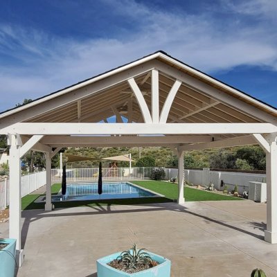 Del Norte Outdoor Kitchen Pavilion (Options: 22' L x 22' W, Douglas-fir, No Privacy Panel, 4-Post Anchor Kit for High-Wind, 10' H Posts, 2 Ceiling Fan Bases, 1 Curtain Rod, No Fascia Boards, Electrical Wiring Trim Kit for 2 Posts, T&G Boards in Sugar Pine with Transparent Premium Sealant by Custom Request, Off-White Oil Based Primer). Photo Courtesy of C. Hypes of Tucson, AZ.