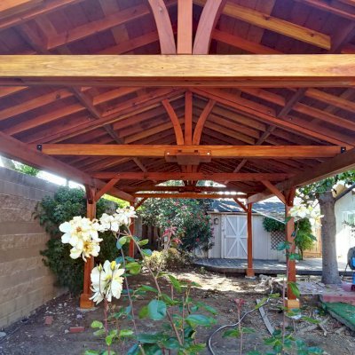 Del Norte Outdoor Kitchen Pavilion (Options: 35' L x 15' W, California Redwood, 6-Post Anchor Kit for High-Wind, 2 Ceiling Fan Bases, 2 Electrical Wiring Trim Kits, No Post Decorative Trims, Transparent Premium Sealant). Photo Courtesy of D. Loyola of San Jose, California.