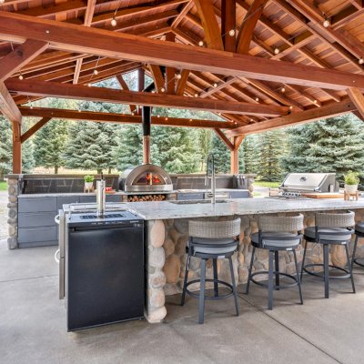 Del Norte Outdoor Kitchen Pavilion (Options: 38.5' L x 18.5' W, California Redwood, No Privacy Panel, Post Anchor Kit for High Wind, 10' H Posts, No Ceiling Fan Base, No Curtain Rod, No Fascia Boards, Transparent Premium Sealant). Photo Courtesy of D. Lemke of Nine Mile Falls, NJ. 