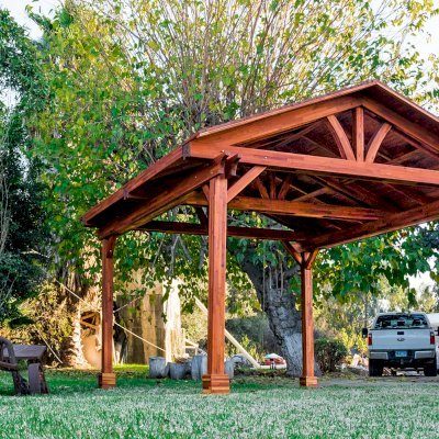 Del Norte Outdoor Kitchen Pavilion (Options: 16' L x 14' W, Mosaic Redwood, 4-Post Anchor Kit for High-Wind, No Ceiling Fan Base, No Electrical Wiring Trim Kit, No Post Decorative Trims, Transparent Premium Sealant). 