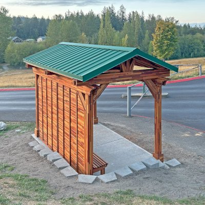 Custom Del Norte Pavilion - Bus Shelter (Options: 14' L x 10' W, Mosaic Redwood, 1 Wall Privacy Panel, Post Anchor Kit for High Wind, 9' H Posts, No Ceiling Fan Base, No Electrical Wiring Trims, No Curtain Rod, Transparent Premium Sealant). Structure Installed at Sehmel Homestead Park in 10123 78th Ave NW, Gig Harbor, WA 98332. , 