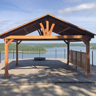 Del Norte Outdoor Kitchen Pavilion (Options: 18' L x 20' W, Douglas-fir, 4-Post Kit for High-Wind, 1 Ceiling Fan Base, 1 Lattice Privacy Panel, 1 Electrical Wiring Trim Kit, No Post Decorative Trims, Transparent Premium Sealant). Photo Courtesy of G. Burris of Elizabeth, AR.