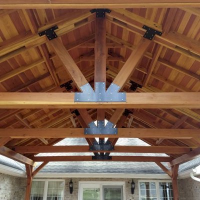 Del Norte Outdoor Kitchen Pavilion (Options: 26' L x 20' W, California Redwood, 6-Post Anchor Kit for High-Wind, Straight Internal Truss Supports by Custom Request, 2 Ceiling Fan Bases, 2 Electrical Wiring Trim Kits, No Post Decorative Trims, Transparent Premium Sealant, with Custom Steel Plating). Roof pitch increased beyond standard amount by customer request. Photo Courtesy of G. Dalby of Knoxville , Tennessee.