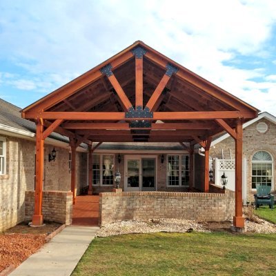 Del Norte Outdoor Kitchen Pavilion (Options: 26' L x 20' W, California Redwood, 6-Post Anchor Kit for High-Wind, Straight Internal Truss Supports by Custom Request, 2 Ceiling Fan Bases, 2 Electrical Wiring Trim Kits, No Post Decorative Trims, Transparent Premium Sealant, with Custom Steel Plating). Roof pitch increased beyond standard amount by customer request. Photo Courtesy of G. Dalby of Knoxville , Tennessee.
