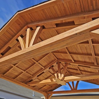 Del Norte Outdoor Kitchen Pavilion (Options: 13' L x 20' W, Mosaic Douglas-fir, No Privacy Panel, 4-Post Anchor Kit for Concrete, 11.5' H Posts, 1 Ceiling Fan Base, No Curtain Rod, No Fascia Boards, Transparent Premium Sealant). Photo Courtesy of H. Hinnant of Piedmont, SC.