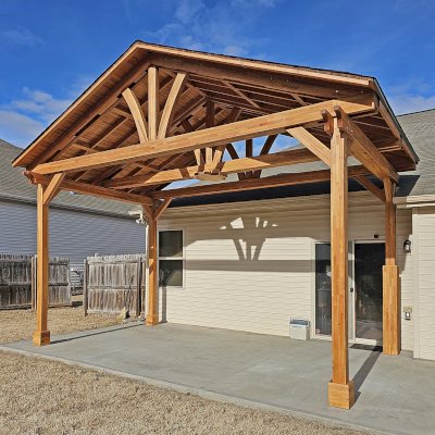 Del Norte Outdoor Kitchen Pavilion (Options: 13' L x 20' W, Mosaic Douglas-fir, No Privacy Panel, 4-Post Anchor Kit for Concrete, 11.5' H Posts, 1 Ceiling Fan Base, No Curtain Rod, No Fascia Boards, Transparent Premium Sealant). Photo Courtesy of H. Hinnant of Piedmont, SC.