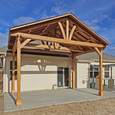Del Norte Outdoor Kitchen Pavilion (Options: 13' L x 20' W, Mosaic Douglas-fir, No Privacy Panel, 4-Post Anchor Kit for Concrete, 11.5' H Posts, 1 Ceiling Fan Base, No Curtain Rod, No Fascia Boards, Transparent Premium Sealant). Photo Courtesy of H. Hinnant of Piedmont, SC.