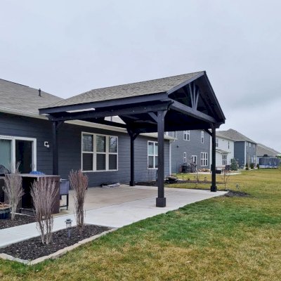 Del Norte Outdoor Kitchen Pavilion (Options: 16' L x 20' W, Mosaic Redwood, No Privacy Panel, 4-Post Anchor Kit for Concrete, 11' H Posts, 1 Ceiling Fan Base, No Curtain Rod, Black Stain Premium Sealant). Photo Courtesy of J. Miller of Brownsburg, Indiana.