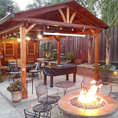 Del Norte Outdoor Kitchen Pavilion (Options: 25' L x 15' W, California Redwood, 6-Post Anchor Kit for Concrete, 4 Ceiling Fan Bases, 2 Electrical Wiring Trim Kits, No Post Decorative Trim, Custom Doors with Louvers & Shutters, Transparent Premium Sealant). Photo Courtesy of J. Gil of San Jose, CA.