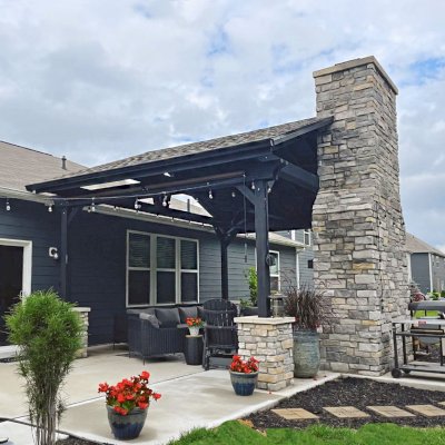Del Norte Outdoor Kitchen Pavilion (Options: 16' L x 20' W, Mosaic Redwood, No Privacy Panel, 4-Post Anchor Kit for Concrete, 11' H Posts, 1 Ceiling Fan Base, No Curtain Rod, Black Stain Premium Sealant). Photo Courtesy of J. Miller of Brownsburg, Indiana.