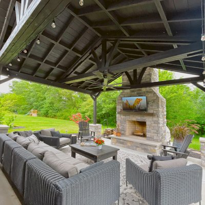 Del Norte Outdoor Kitchen Pavilion (Options: 16' L x 20' W, Mosaic Redwood, No Privacy Panel, 4-Post Anchor Kit for Concrete, 11' H Posts, 1 Ceiling Fan Base, No Curtain Rod, Black Stain Premium Sealant). Photo Courtesy of J. Miller of Brownsburg, Indiana.