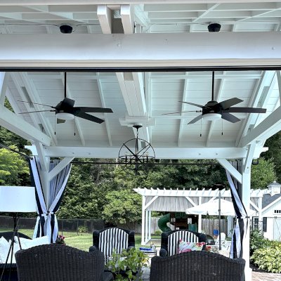Del Norte Outdoor Kitchen Pavilion (Options: 15' L x 18' W, Mosaic Douglas-Fir, 4-Post Anchor Kit for Concrete, 9.5' H Posts, 1 Ceiling Fan Base, 1 Electrical Wiring Trim Kit, 4 Curtain Rods, White Stain Premium Sealant). Photo Courtesy of S. Leonard of Easton, MA.